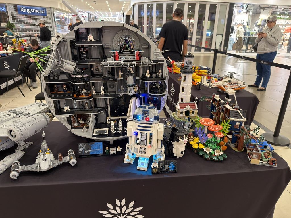 A LEGO Death Star, R2-D2 and other Star Wars builds on a display table